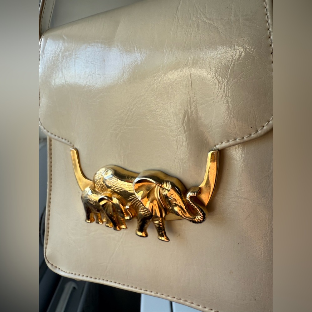 1980s Elegant Cream Bag with Gold Elephant Detail